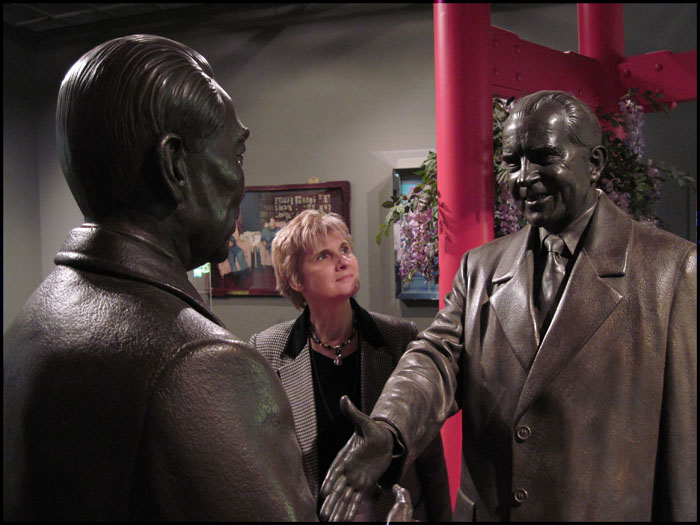 Pamla Eisenberg Pam with statues in Museum gallery (Can you name these familiar faces?)
