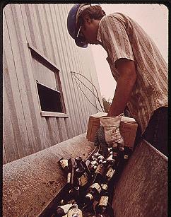 USED BEER BOTTLES ARE FED INTO GLASS CRUSHER FOR PULVERIZING THEY WILL BE COMPLETELY RECYCLED INTO NEW BOTTLES FOR COORS BREWERY. COLUMBINE GLASS COMPANY, 06/1972