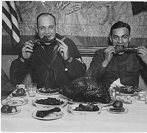 Thanksgiving cheer distributed for men in service. New York City turned host to the boys in service today and cared for every man in uniform. Underwood and Underwood., ca. 1918
